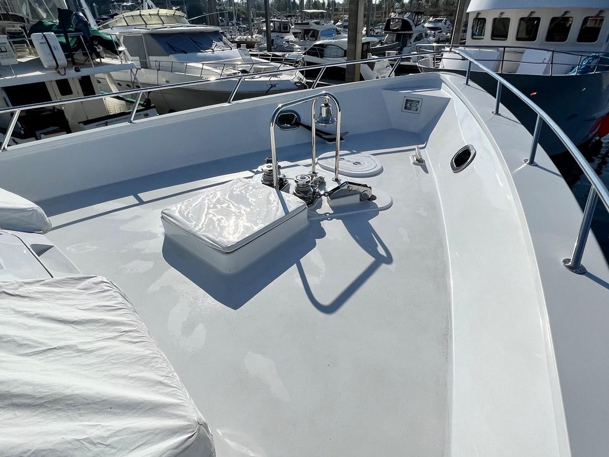 a boat in the water aboard 2001 BROWARD RAISED PILOTHOUSE MY Yacht for Sale