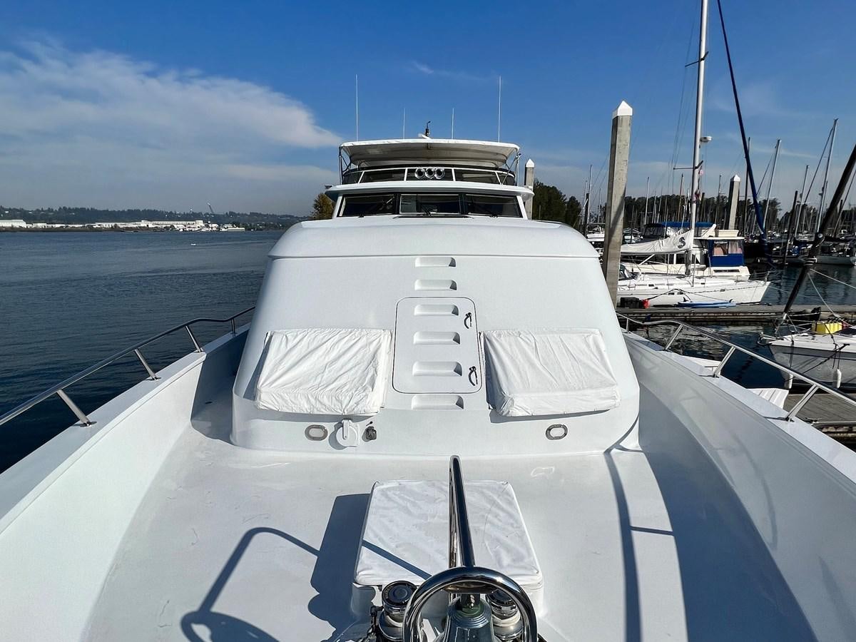 a boat in the water aboard 2001 BROWARD RAISED PILOTHOUSE MY Yacht for Sale