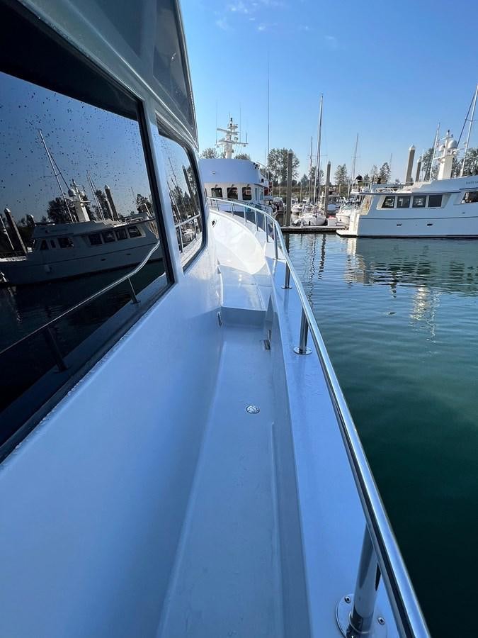 a group of boats on a body of water aboard 2001 BROWARD RAISED PILOTHOUSE MY Yacht for Sale