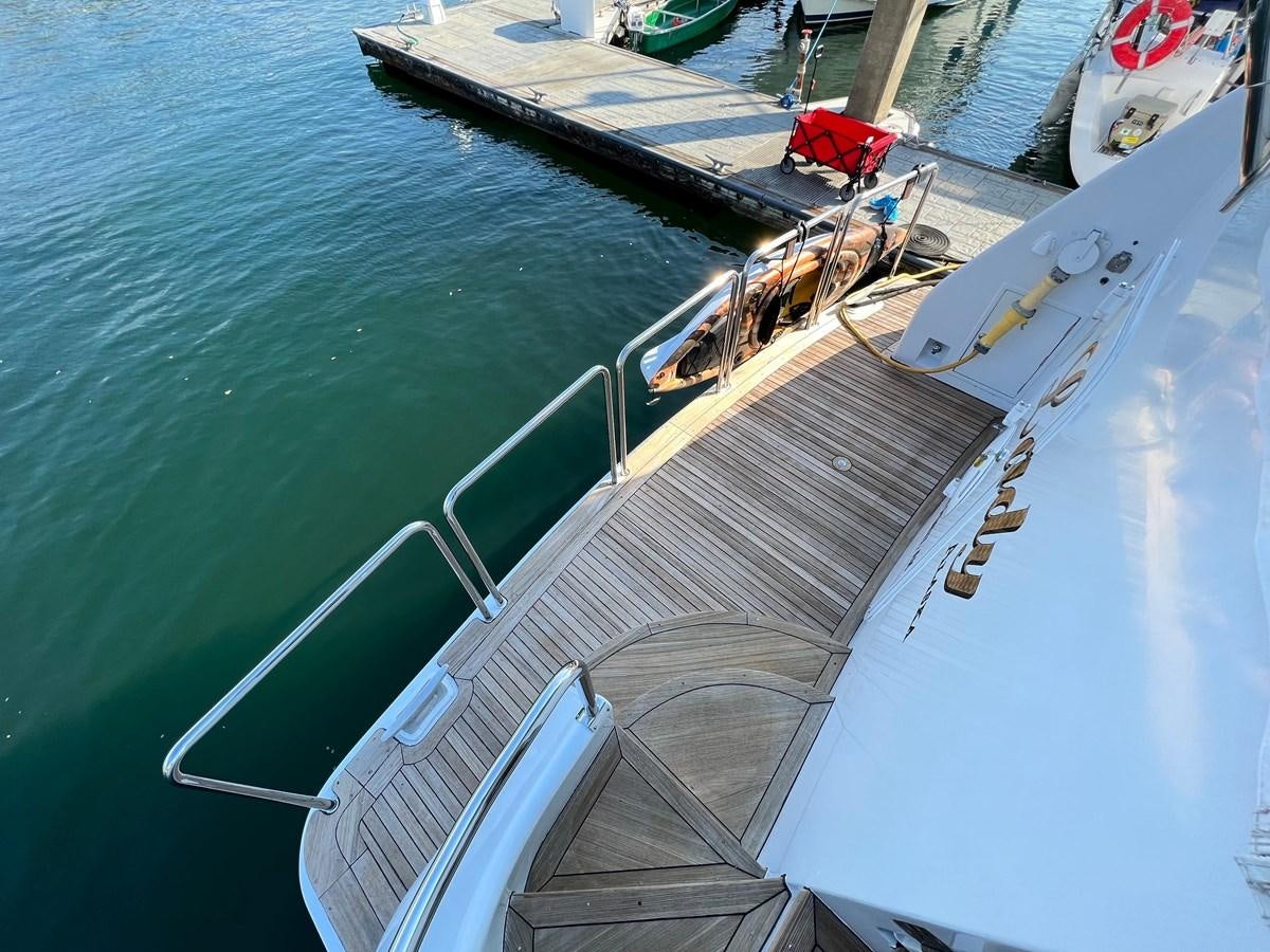 a boat on the water aboard 2001 BROWARD RAISED PILOTHOUSE MY Yacht for Sale