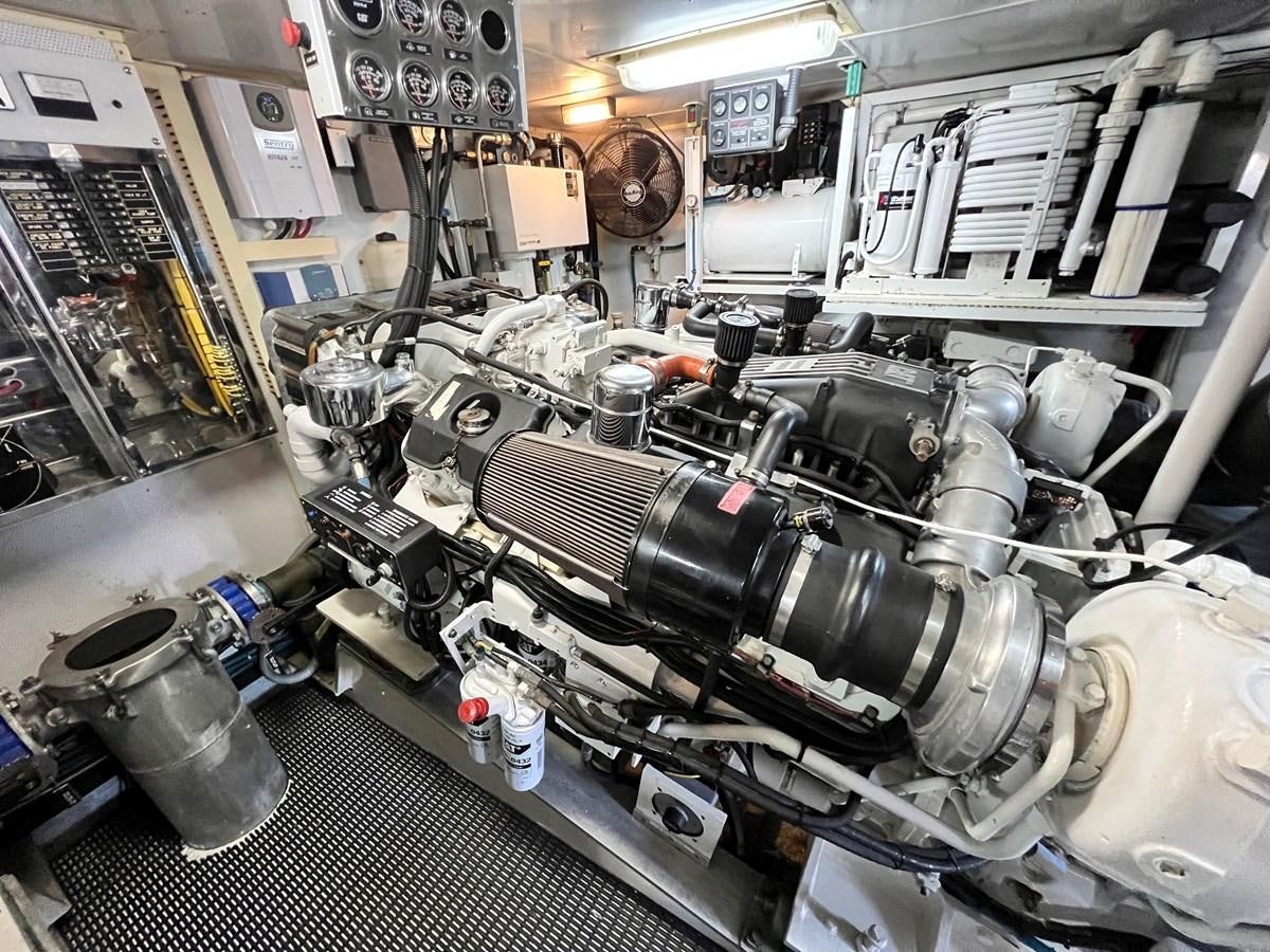 a large machine in a room aboard 2001 BROWARD RAISED PILOTHOUSE MY Yacht for Sale