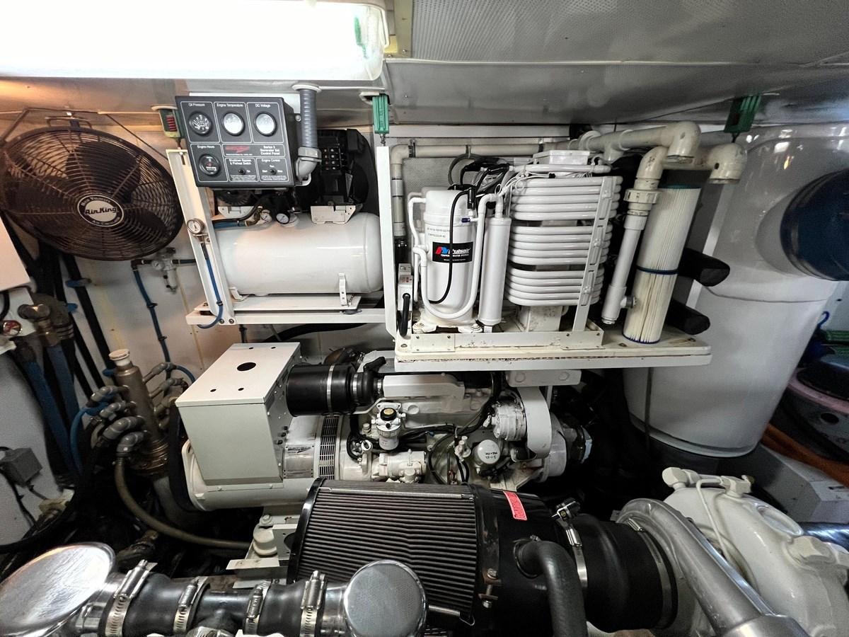a close-up of a car engine aboard 2001 BROWARD RAISED PILOTHOUSE MY Yacht for Sale