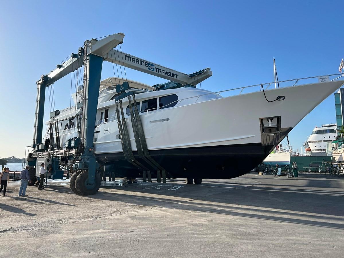 a large machine on a trailer aboard 2001 BROWARD RAISED PILOTHOUSE MY Yacht for Sale