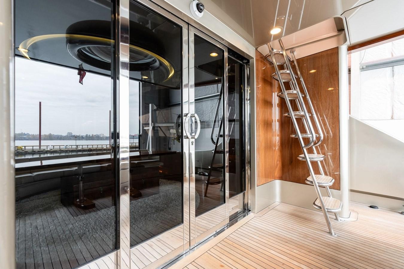 a glass door leading to a balcony aboard 1996 ADMIRAL MARINE 71 Yacht for Sale