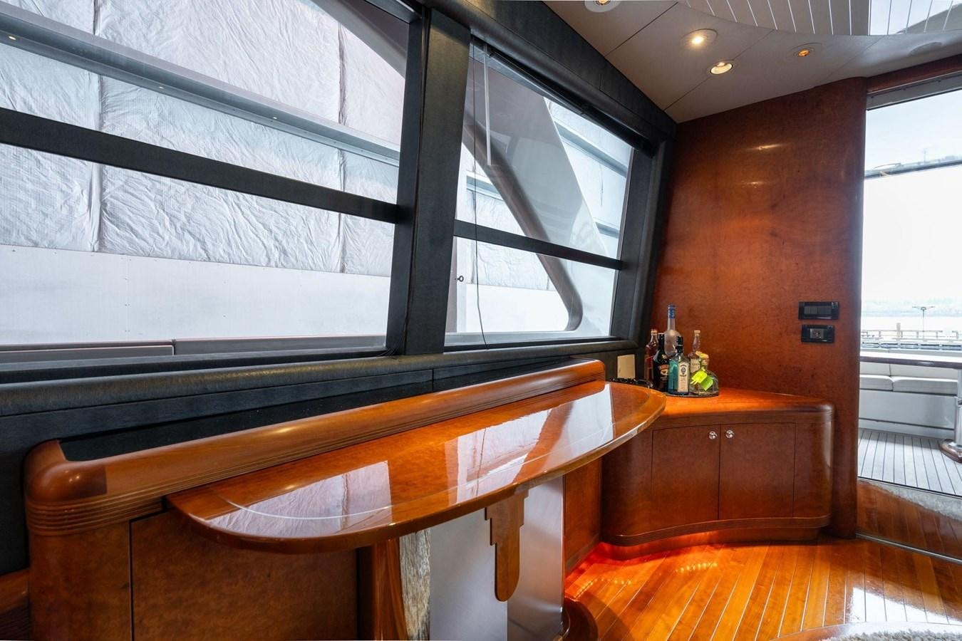 a room with a table and chairs aboard 1996 ADMIRAL MARINE 71 Yacht for Sale