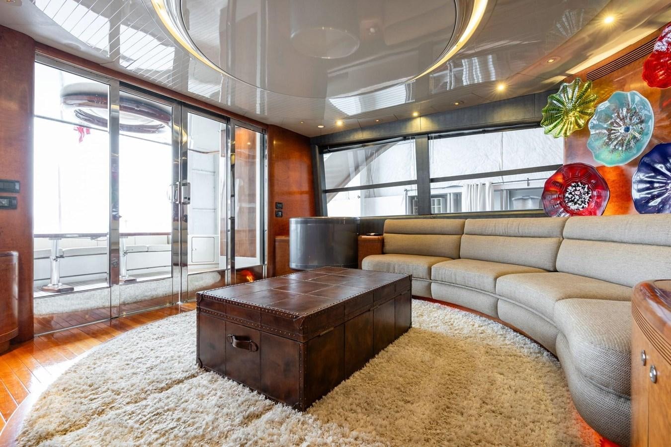a living room with a couch and a coffee table aboard 1996 ADMIRAL MARINE 71 Yacht for Sale