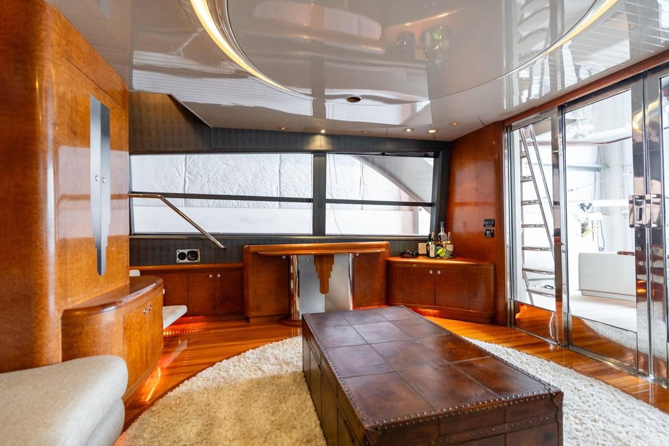 a room with a table and chairs aboard 1996 ADMIRAL MARINE 71 Yacht for Sale