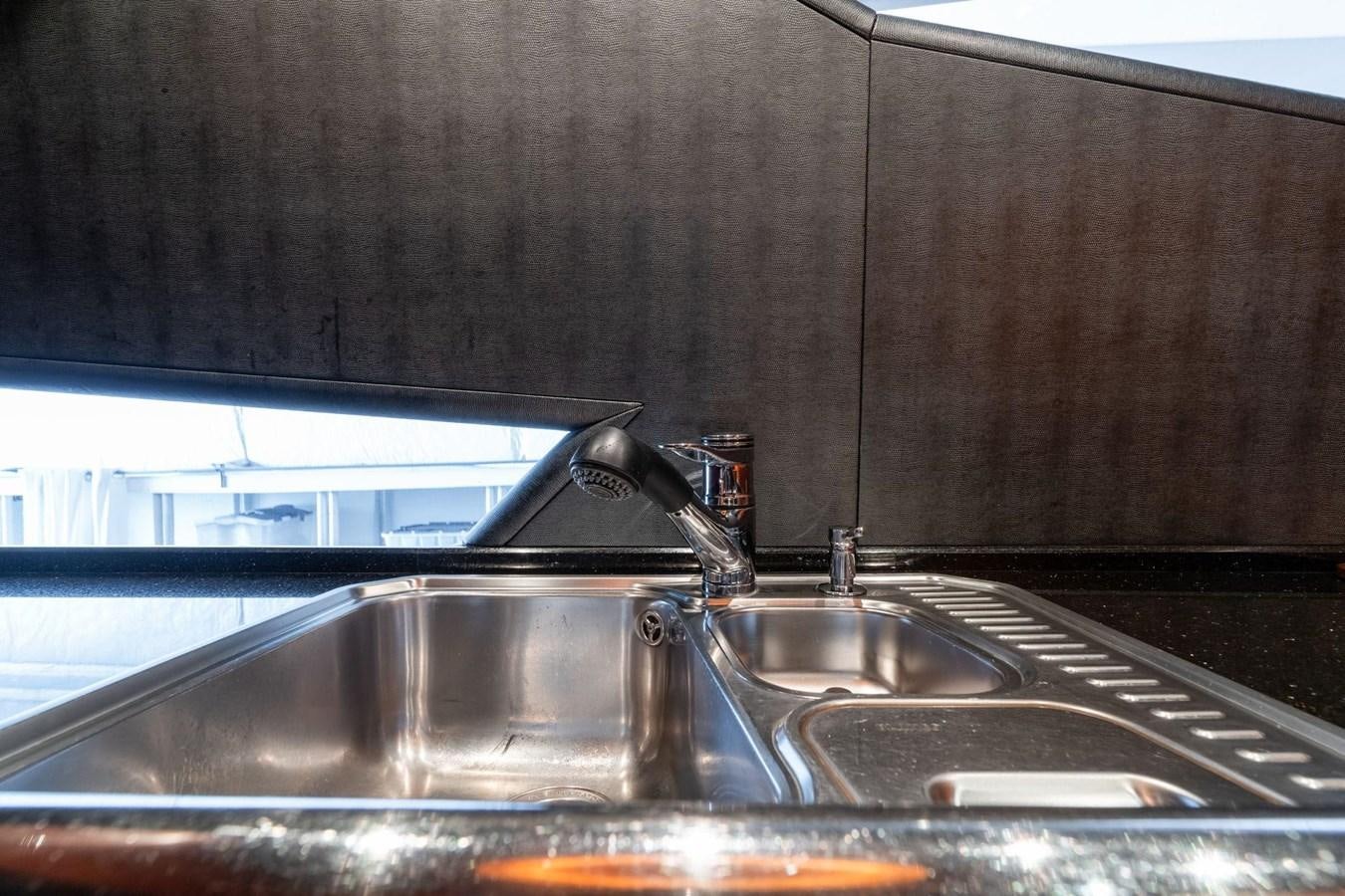 a sink with a faucet aboard 1996 ADMIRAL MARINE 71 Yacht for Sale