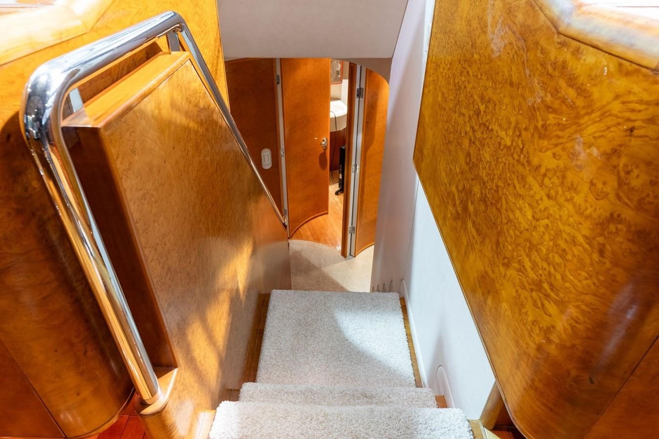 a staircase with a carpet aboard 1996 ADMIRAL MARINE 71 Yacht for Sale