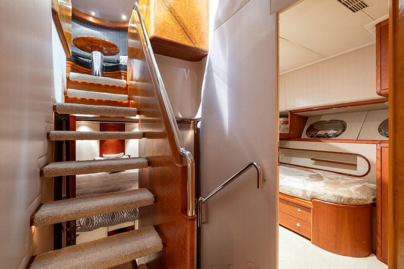 a kitchen with a wooden chair aboard 1996 ADMIRAL MARINE 71 Yacht for Sale