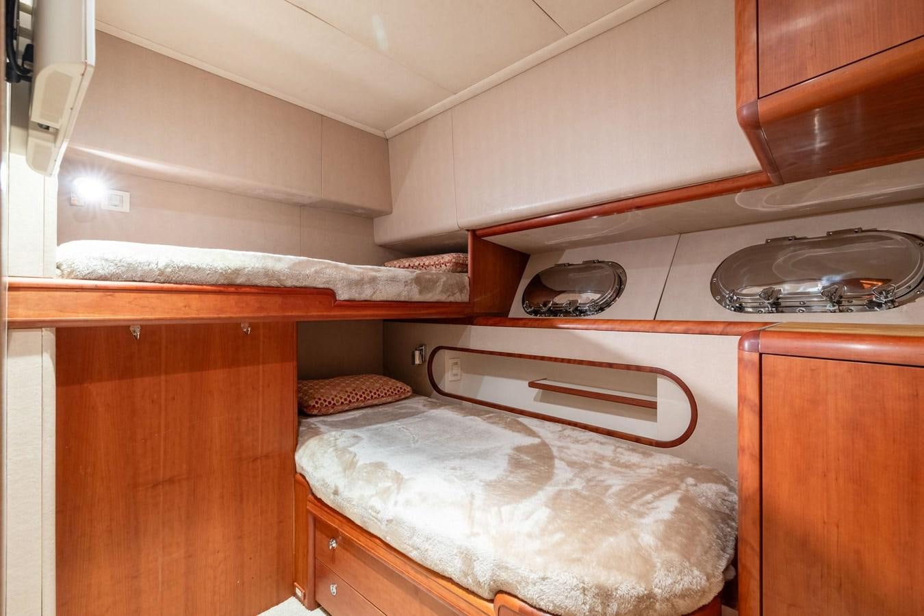 a kitchen with wooden cabinets aboard 1996 ADMIRAL MARINE 71 Yacht for Sale
