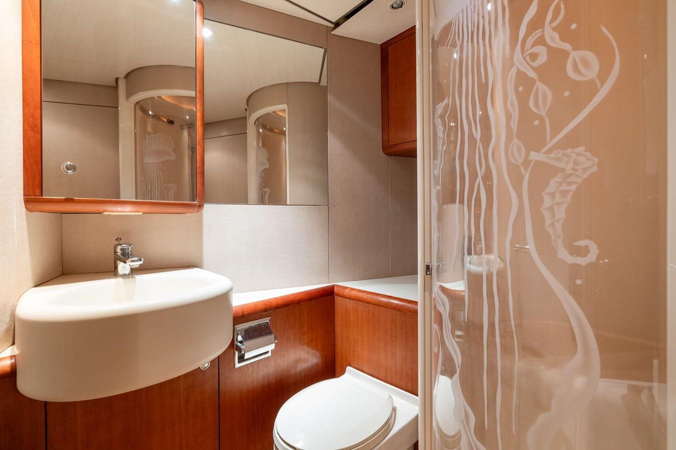 a bathroom with a sink and a toilet aboard 1996 ADMIRAL MARINE 71 Yacht for Sale