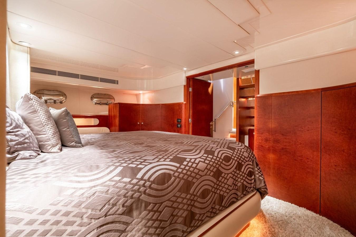 a bed with white sheets aboard 1996 ADMIRAL MARINE 71 Yacht for Sale