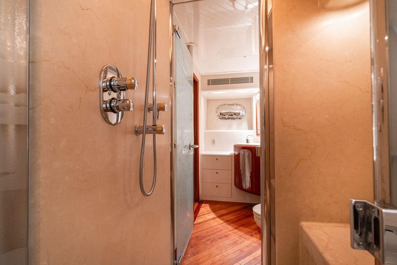 a room with a door and a sink aboard 1996 ADMIRAL MARINE 71 Yacht for Sale
