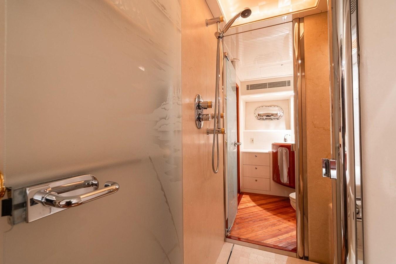 a room with a door and a sink aboard 1996 ADMIRAL MARINE 71 Yacht for Sale