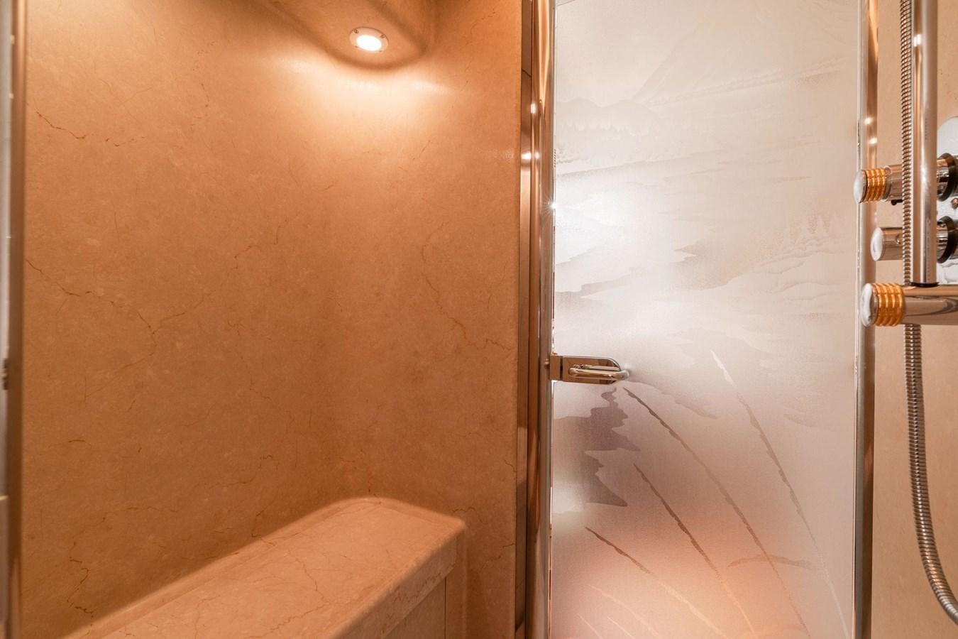 a bathroom with a shower aboard 1996 ADMIRAL MARINE 71 Yacht for Sale