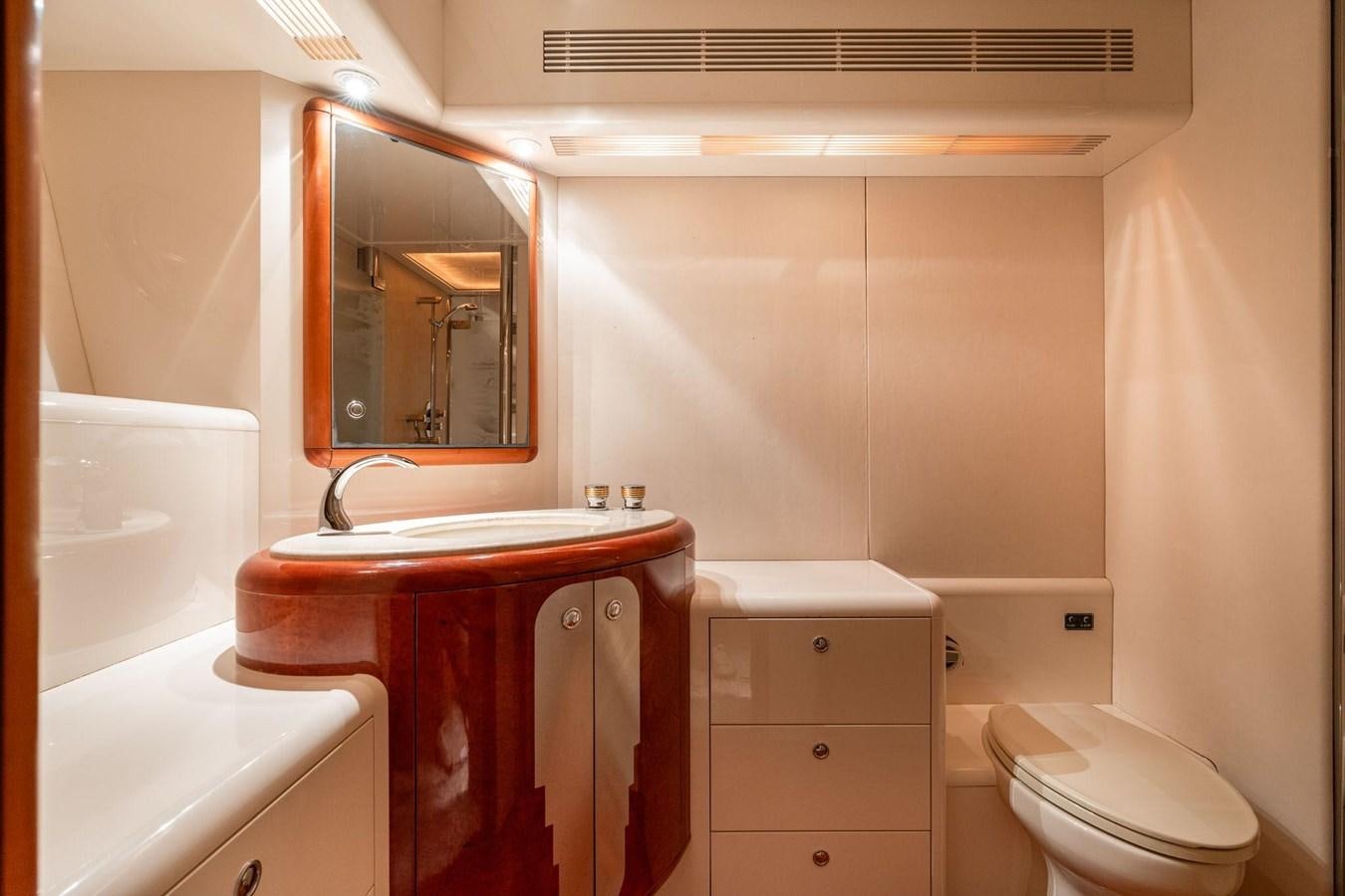 a bathroom with a sink and a toilet aboard 1996 ADMIRAL MARINE 71 Yacht for Sale