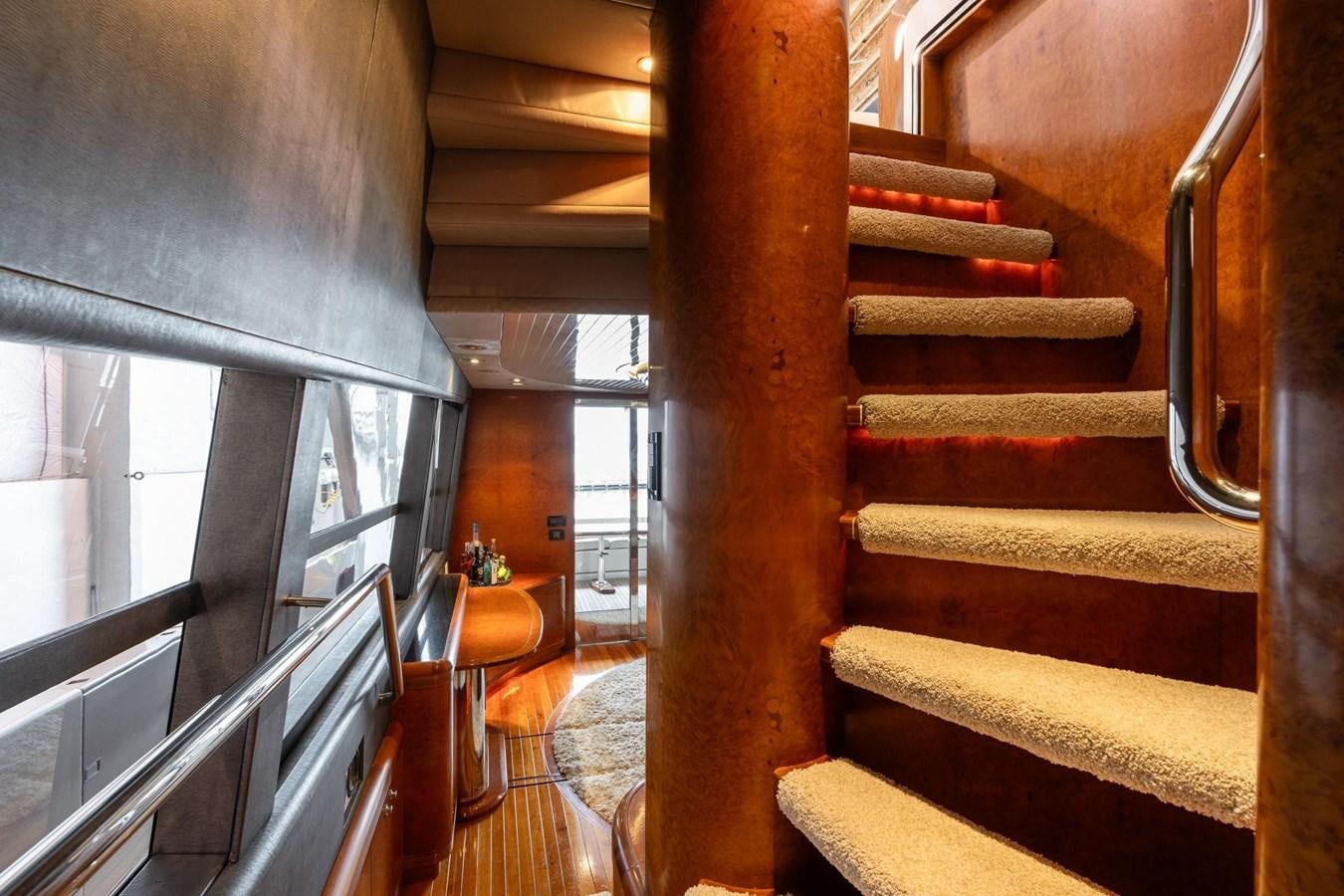 a wooden staircase with a wood railing aboard 1996 ADMIRAL MARINE 71 Yacht for Sale