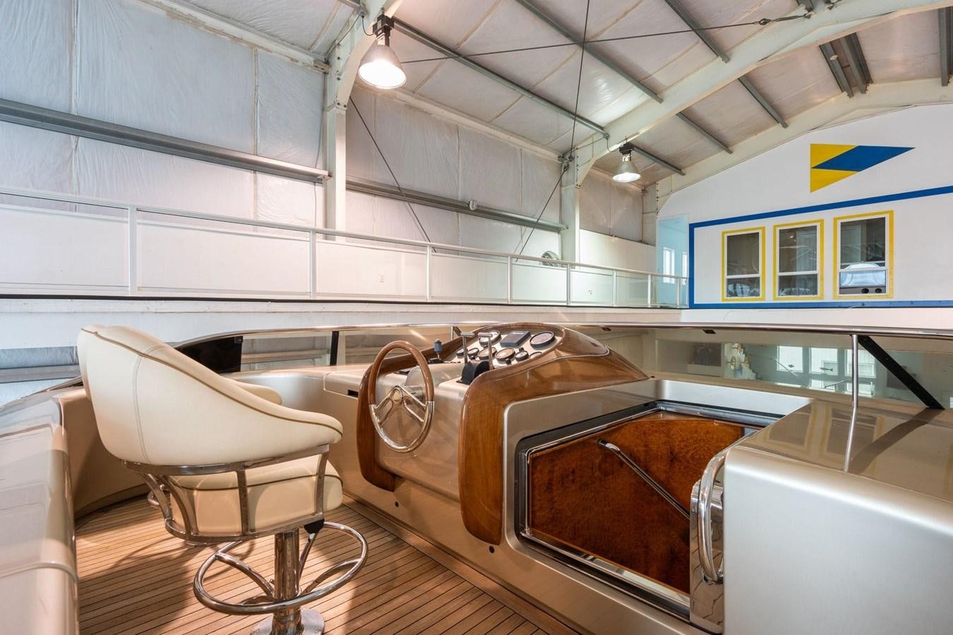 a room with a chair and a table and a couch aboard 1996 ADMIRAL MARINE 71 Yacht for Sale