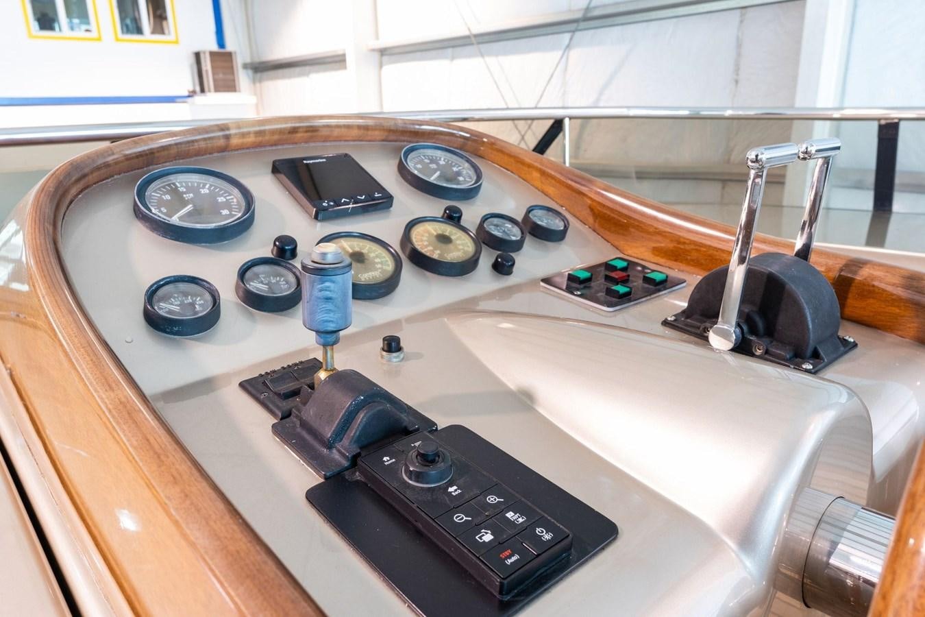 a control panel with buttons and dials on it aboard 1996 ADMIRAL MARINE 71 Yacht for Sale