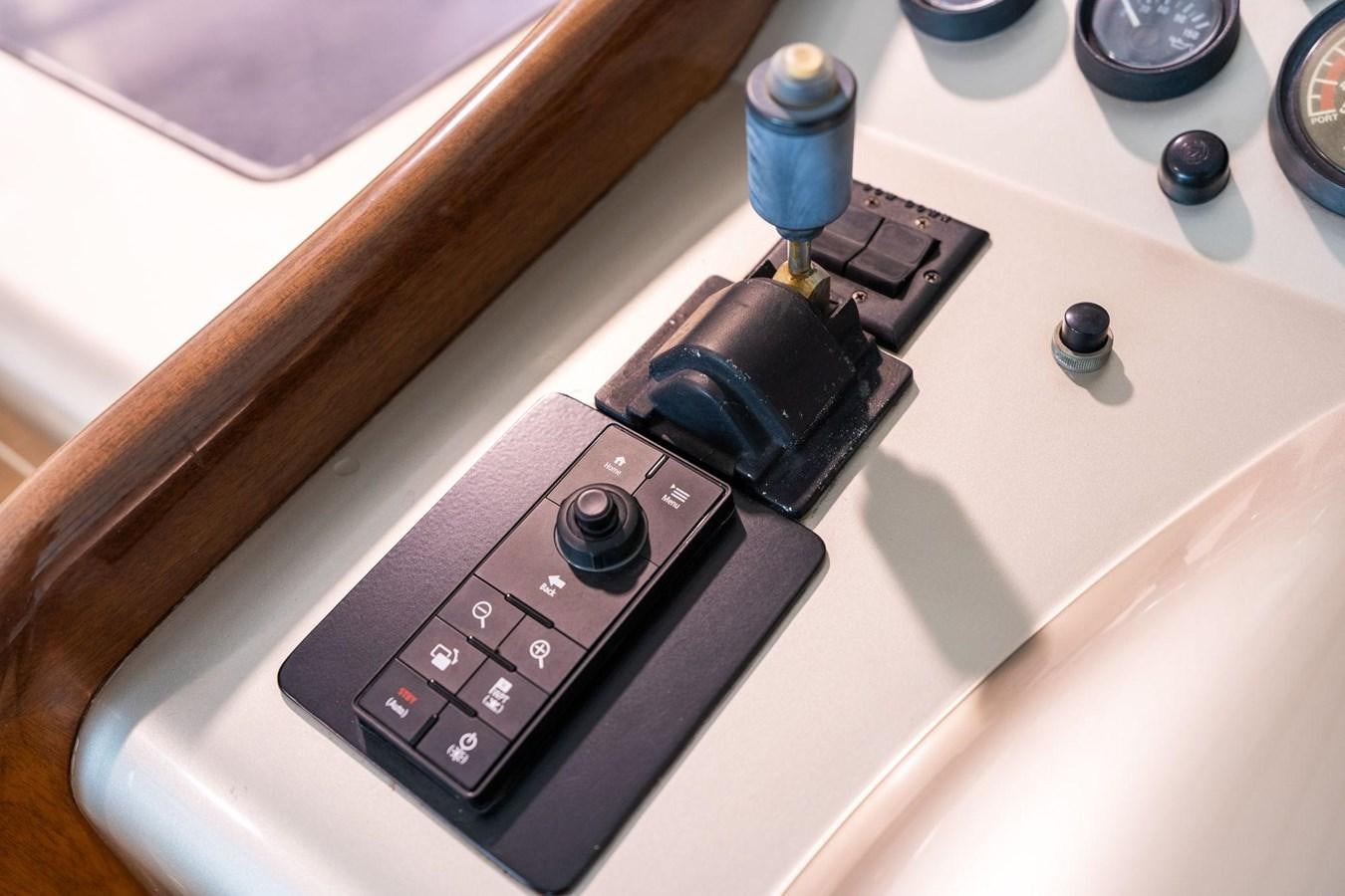 a black electronic device aboard 1996 ADMIRAL MARINE 71 Yacht for Sale