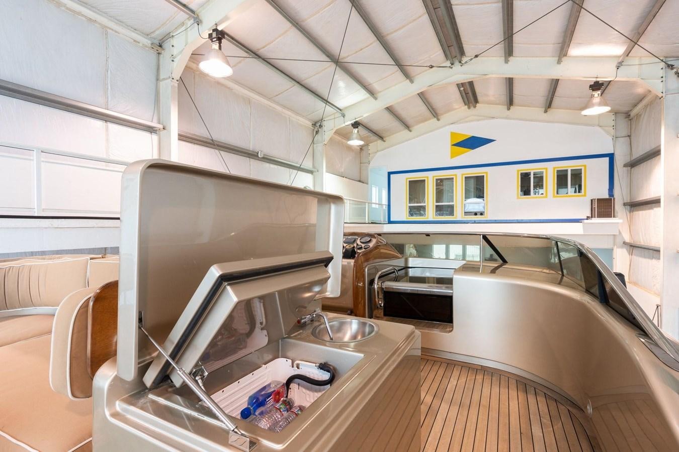 a kitchen with a sink and a microwave aboard 1996 ADMIRAL MARINE 71 Yacht for Sale