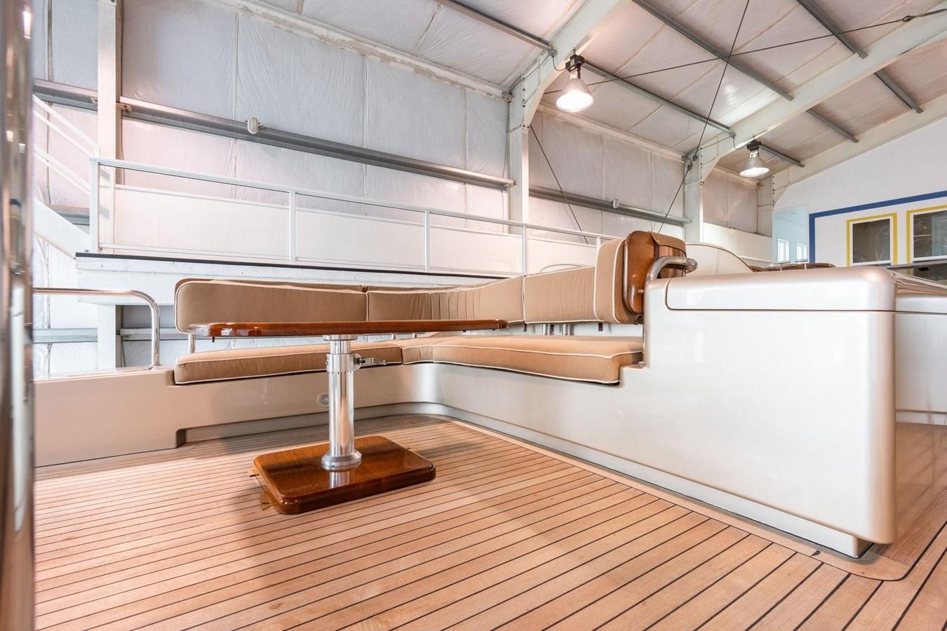 a kitchen with a wood floor aboard 1996 ADMIRAL MARINE 71 Yacht for Sale