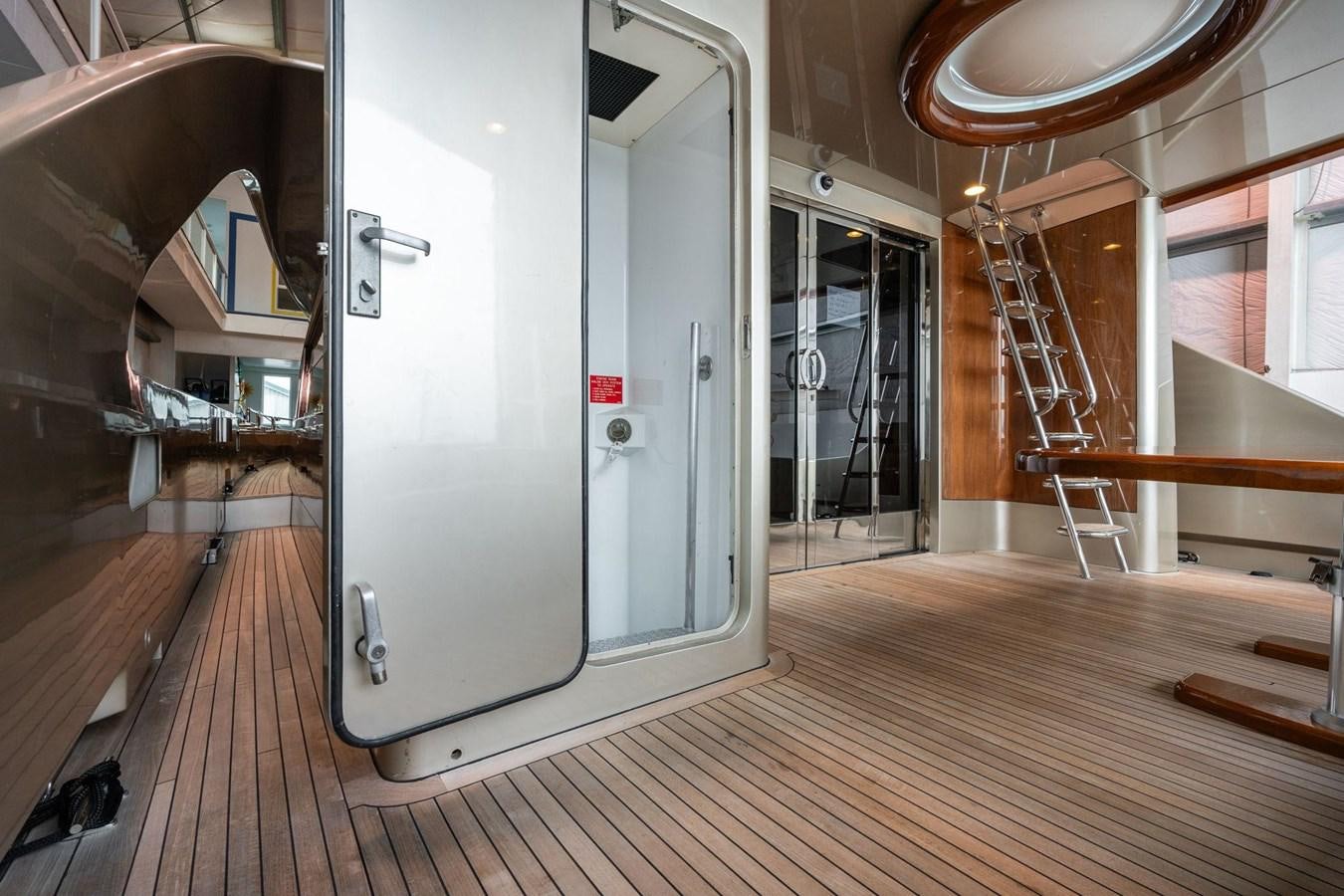 a room with a door and a mirror on the wall aboard 1996 ADMIRAL MARINE 71 Yacht for Sale