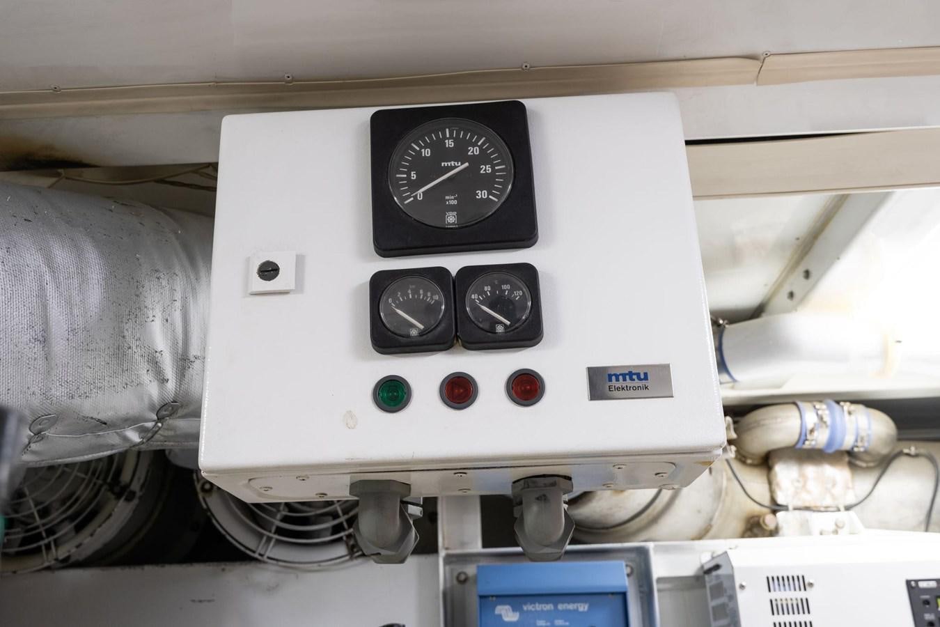 a white machine with a black dial aboard 1996 ADMIRAL MARINE 71 Yacht for Sale