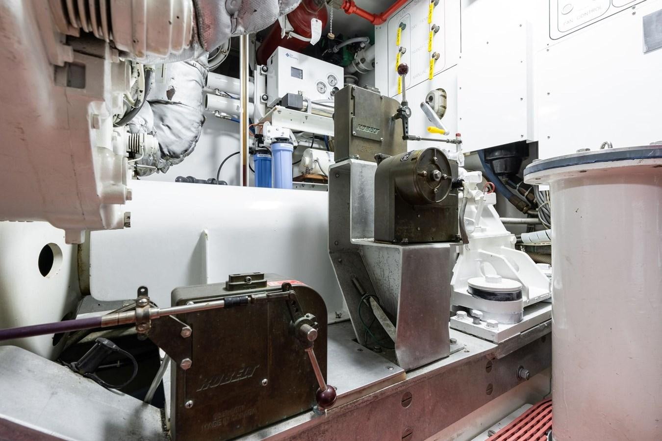 a machine with pipes aboard 1996 ADMIRAL MARINE 71 Yacht for Sale