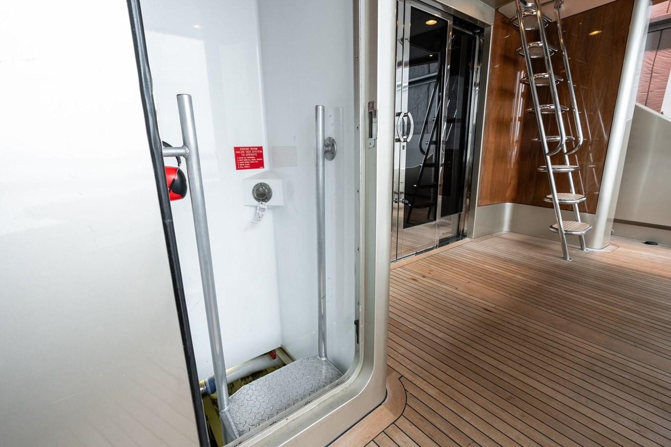 a hallway with glass doors aboard 1996 ADMIRAL MARINE 71 Yacht for Sale
