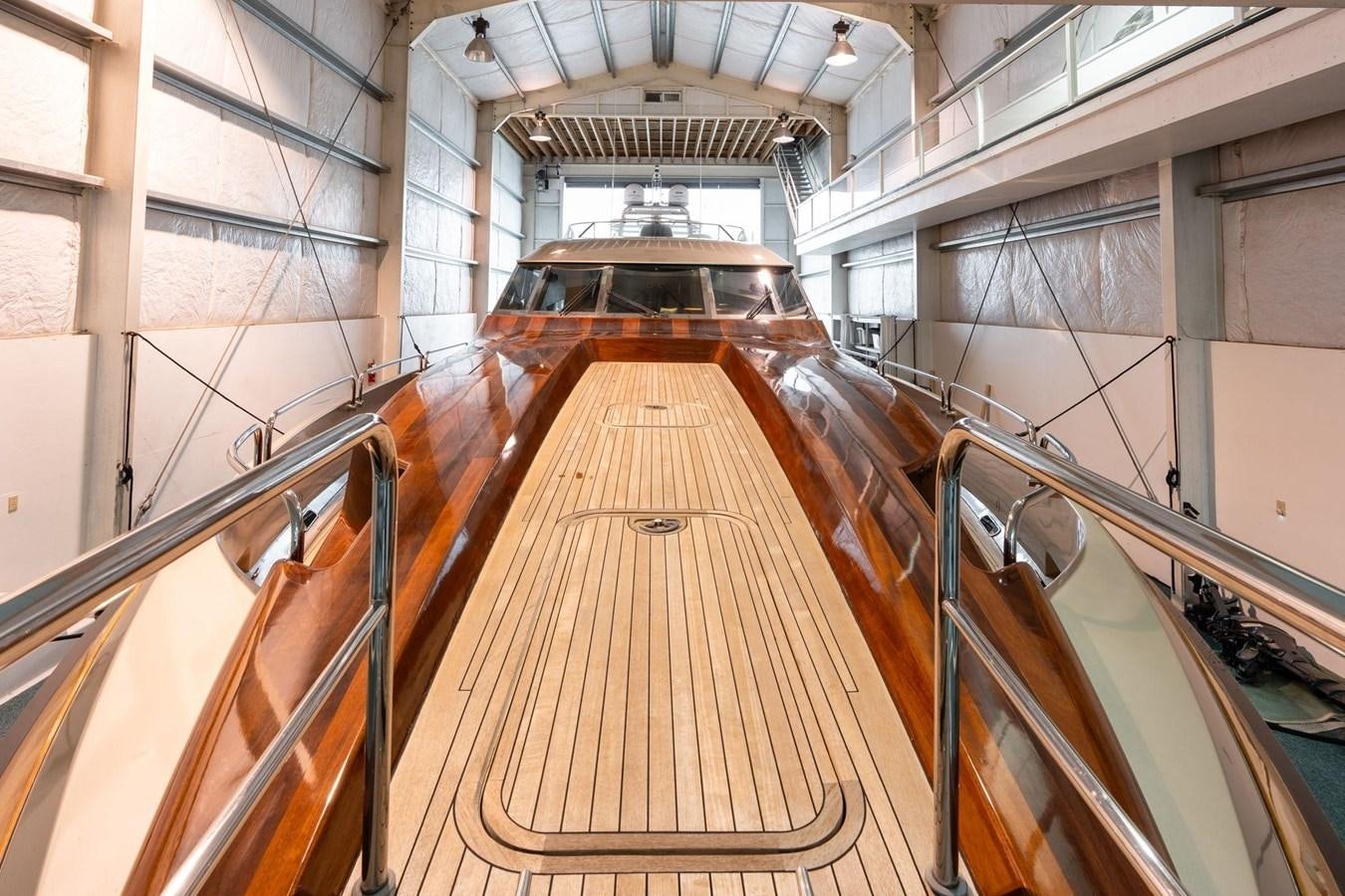 a large hallway with wooden stairs aboard 1996 ADMIRAL MARINE 71 Yacht for Sale