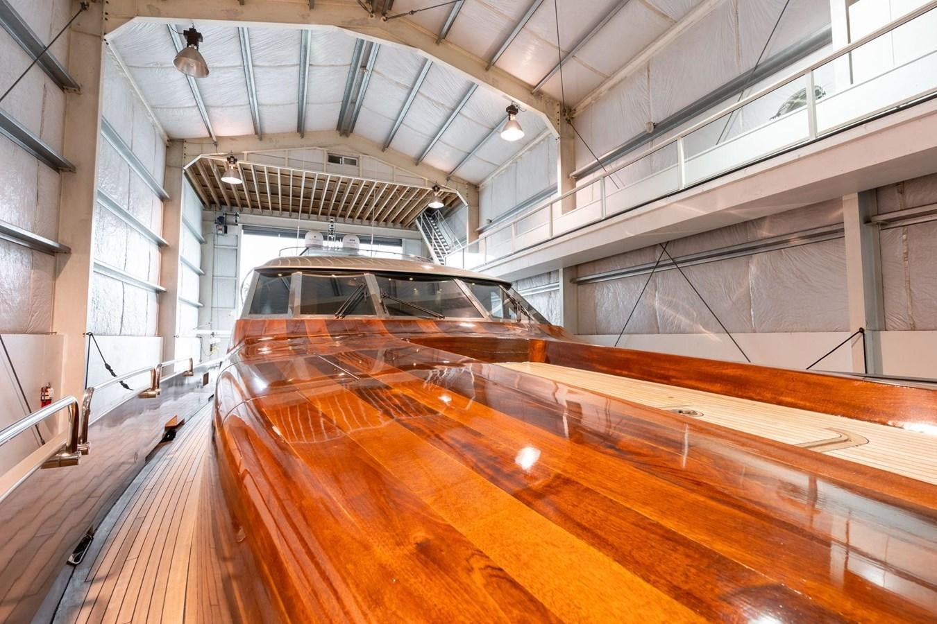 a car driving through a large building aboard 1996 ADMIRAL MARINE 71 Yacht for Sale