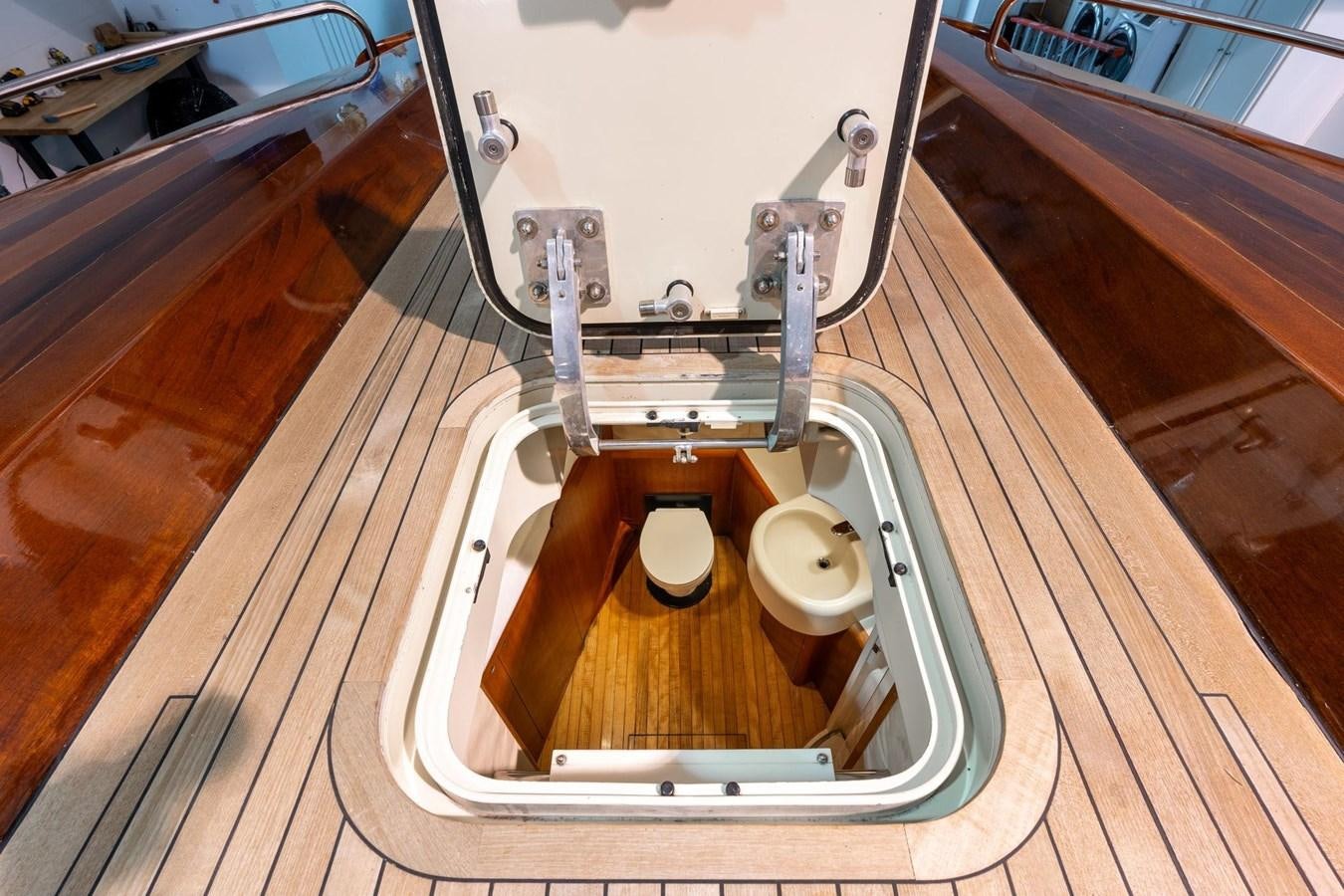 a metal contraption on a wooden surface aboard 1996 ADMIRAL MARINE 71 Yacht for Sale