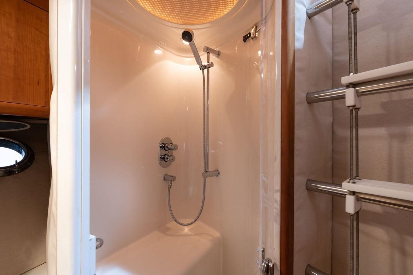 a shower with a light aboard 1996 ADMIRAL MARINE 71 Yacht for Sale