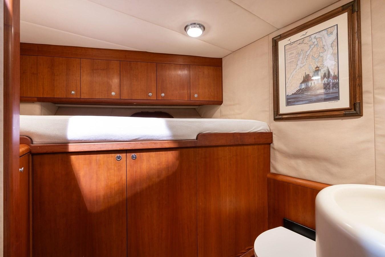 a room with wooden cabinets aboard 1996 ADMIRAL MARINE 71 Yacht for Sale