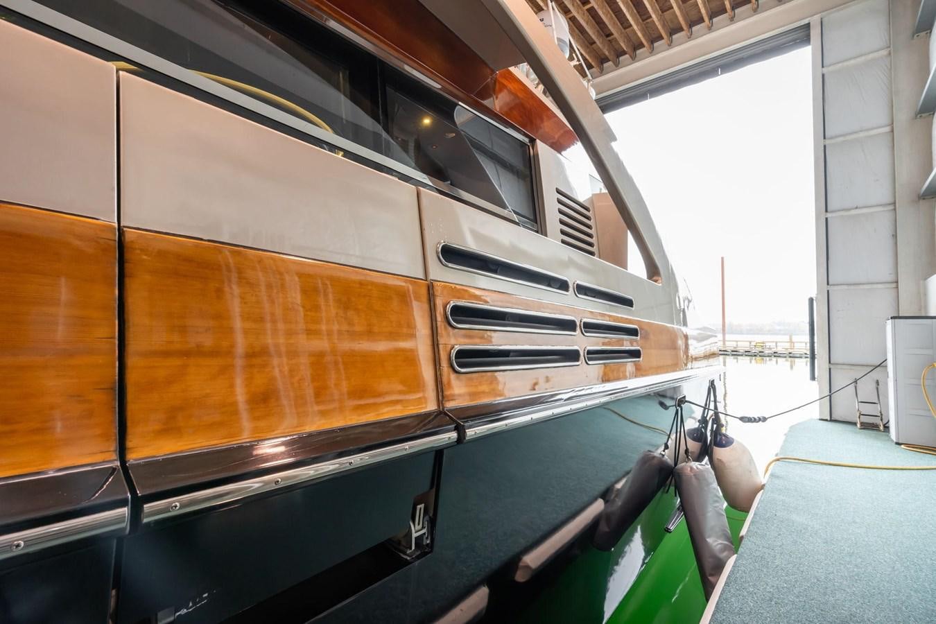 a large brown vehicle aboard 1996 ADMIRAL MARINE 71 Yacht for Sale