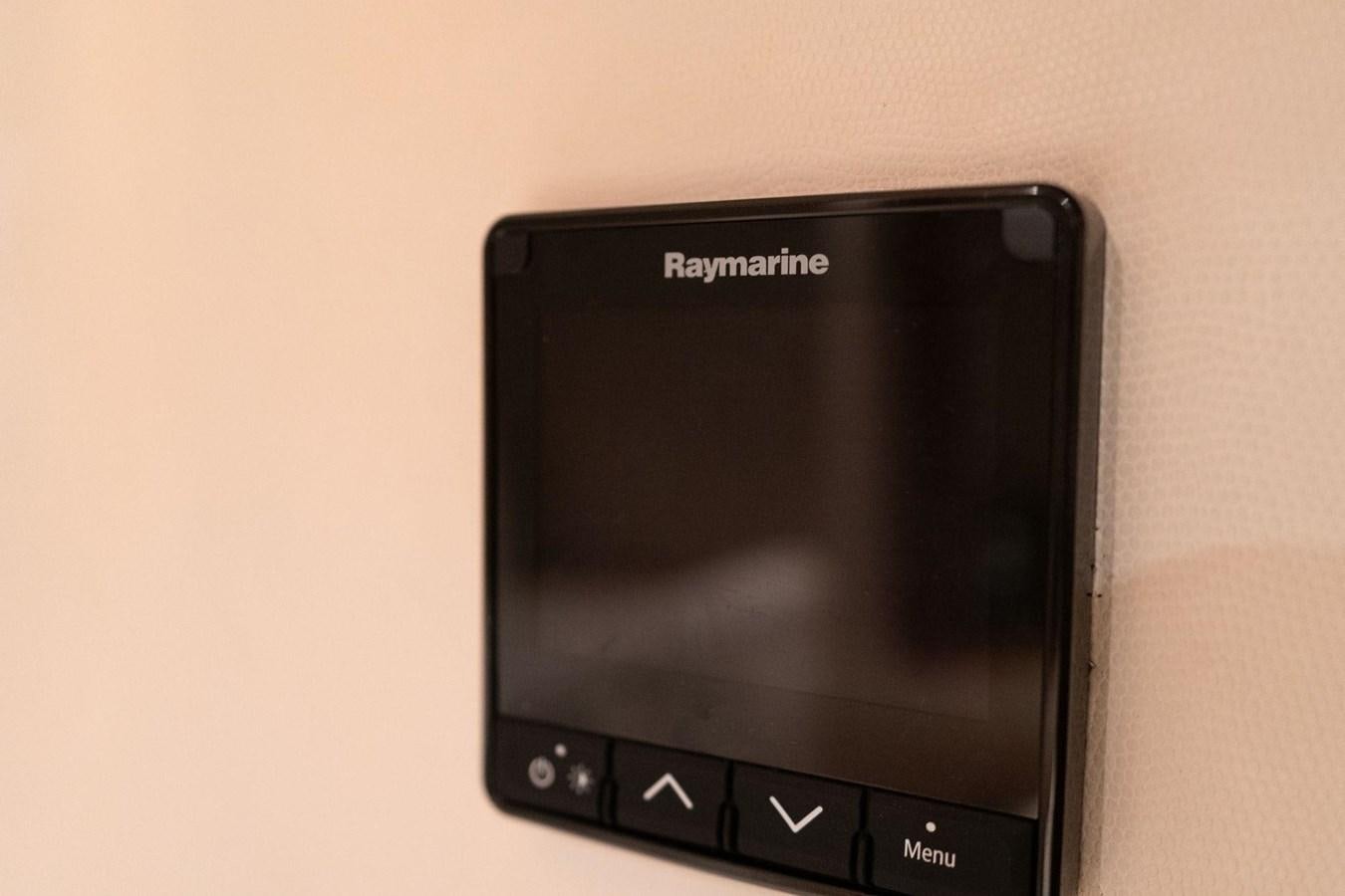 a black cell phone aboard 1996 ADMIRAL MARINE 71 Yacht for Sale