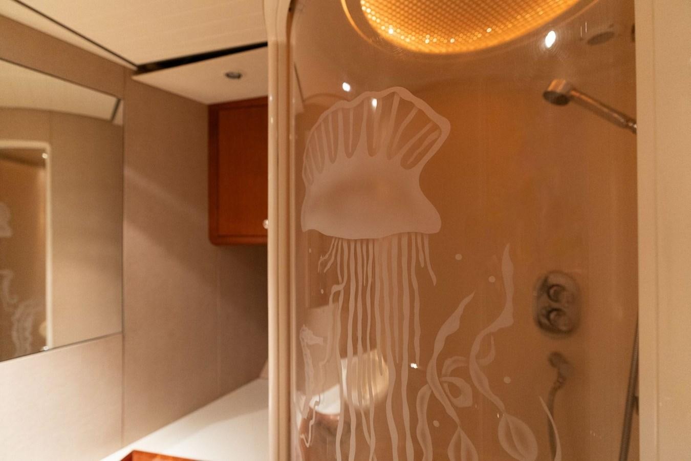 a glass door with a drawing of a spider on it aboard 1996 ADMIRAL MARINE 71 Yacht for Sale