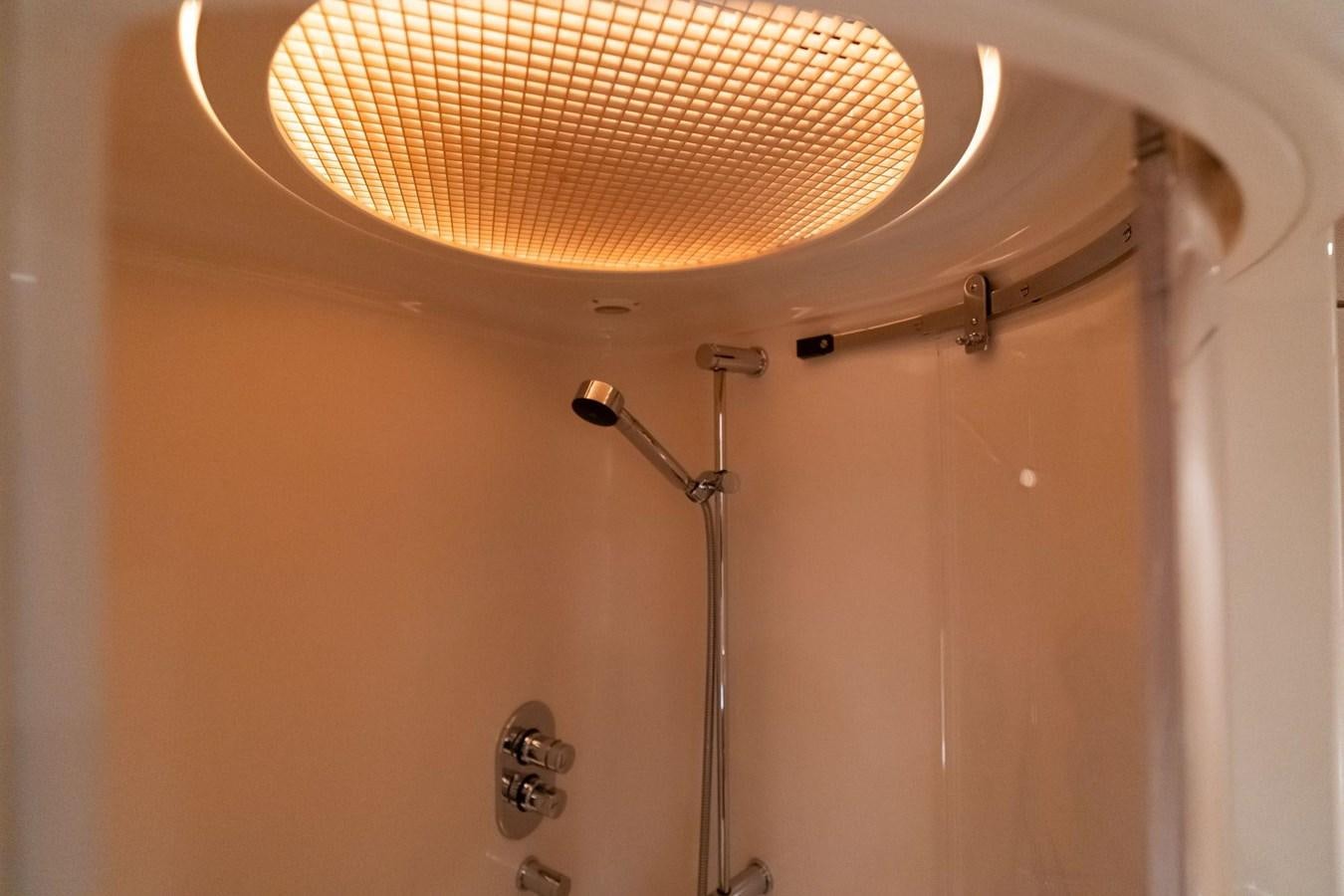 a ceiling fan in a room aboard 1996 ADMIRAL MARINE 71 Yacht for Sale