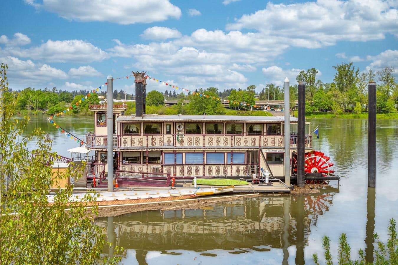 a building next to a body of water aboard 1990 CUSTOM HOWDY EIDELMAN STERNWHEELER - JACK SARIN Yacht for Sale