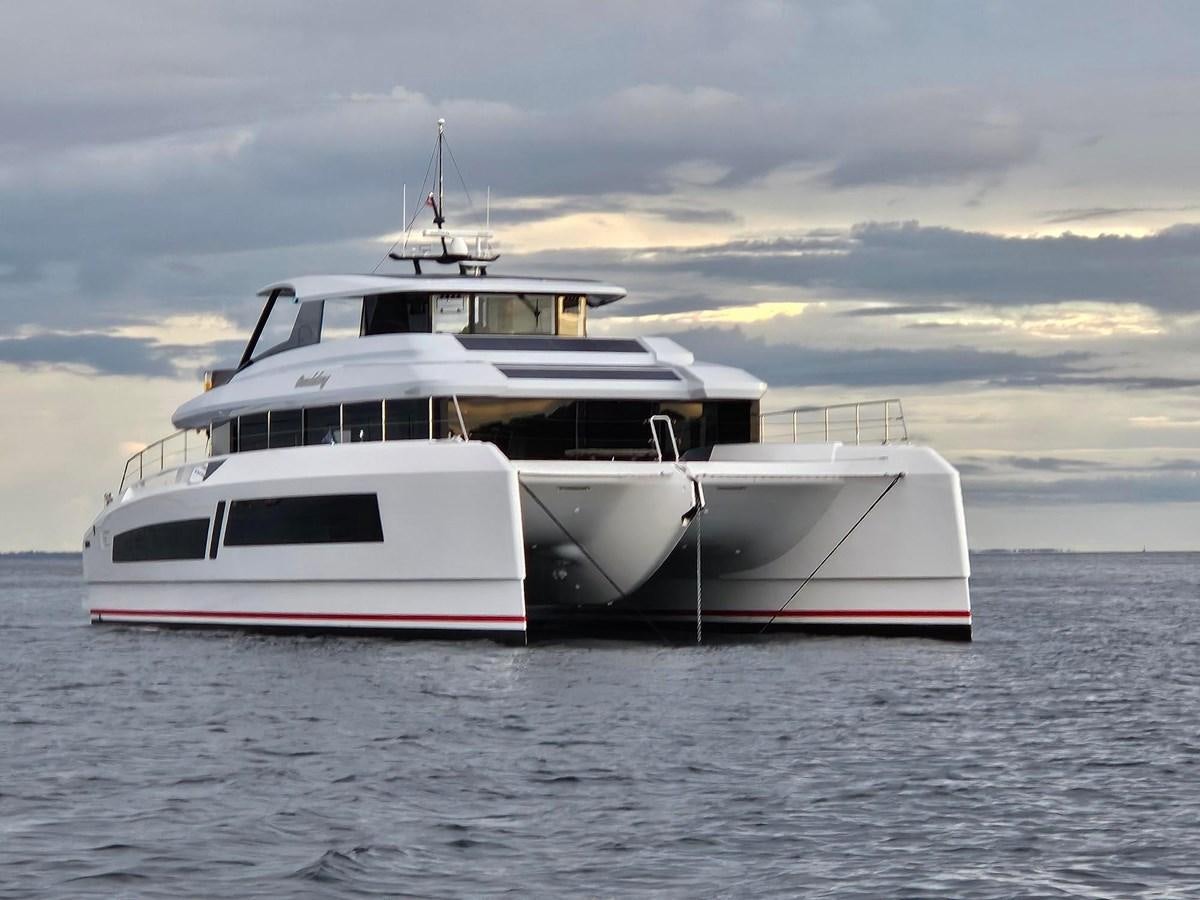 a couple of white boats in the water aboard BUNDALONG Yacht for Sale