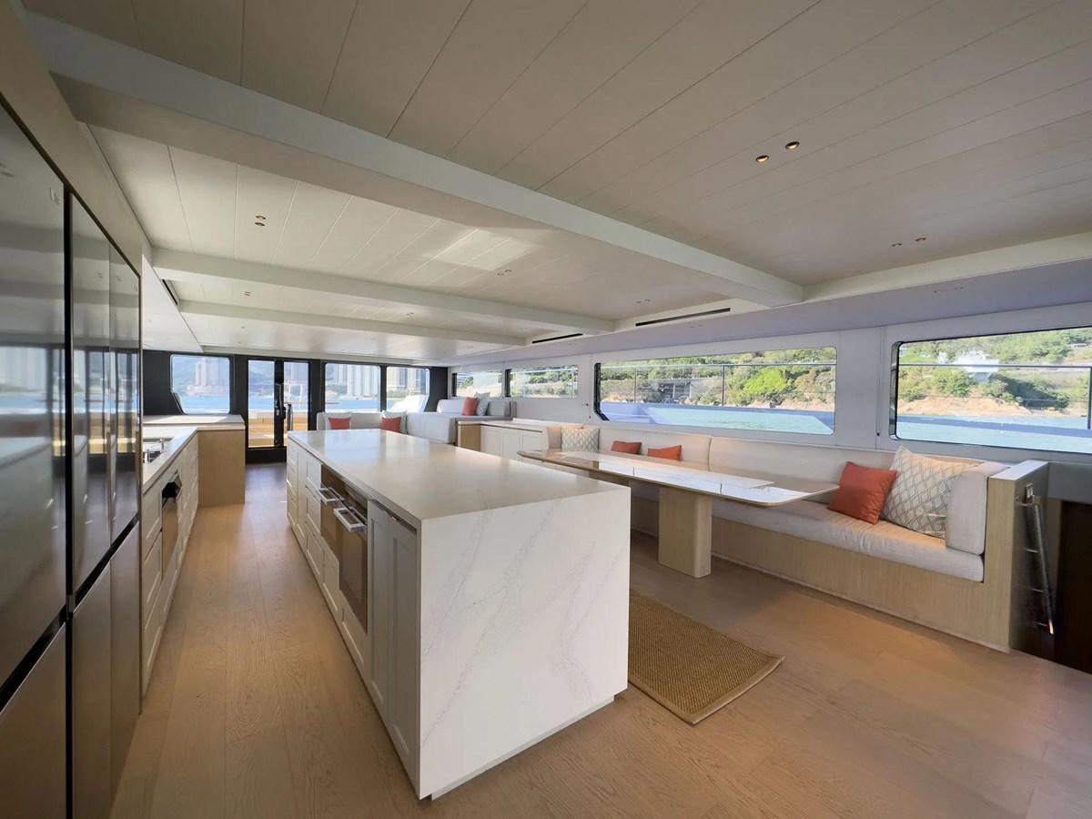 a room with a couch and a table aboard BUNDALONG Yacht for Sale