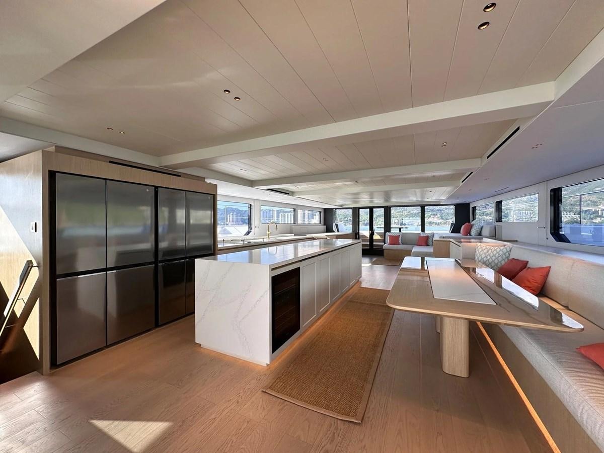 a room with a table and chairs aboard BUNDALONG Yacht for Sale