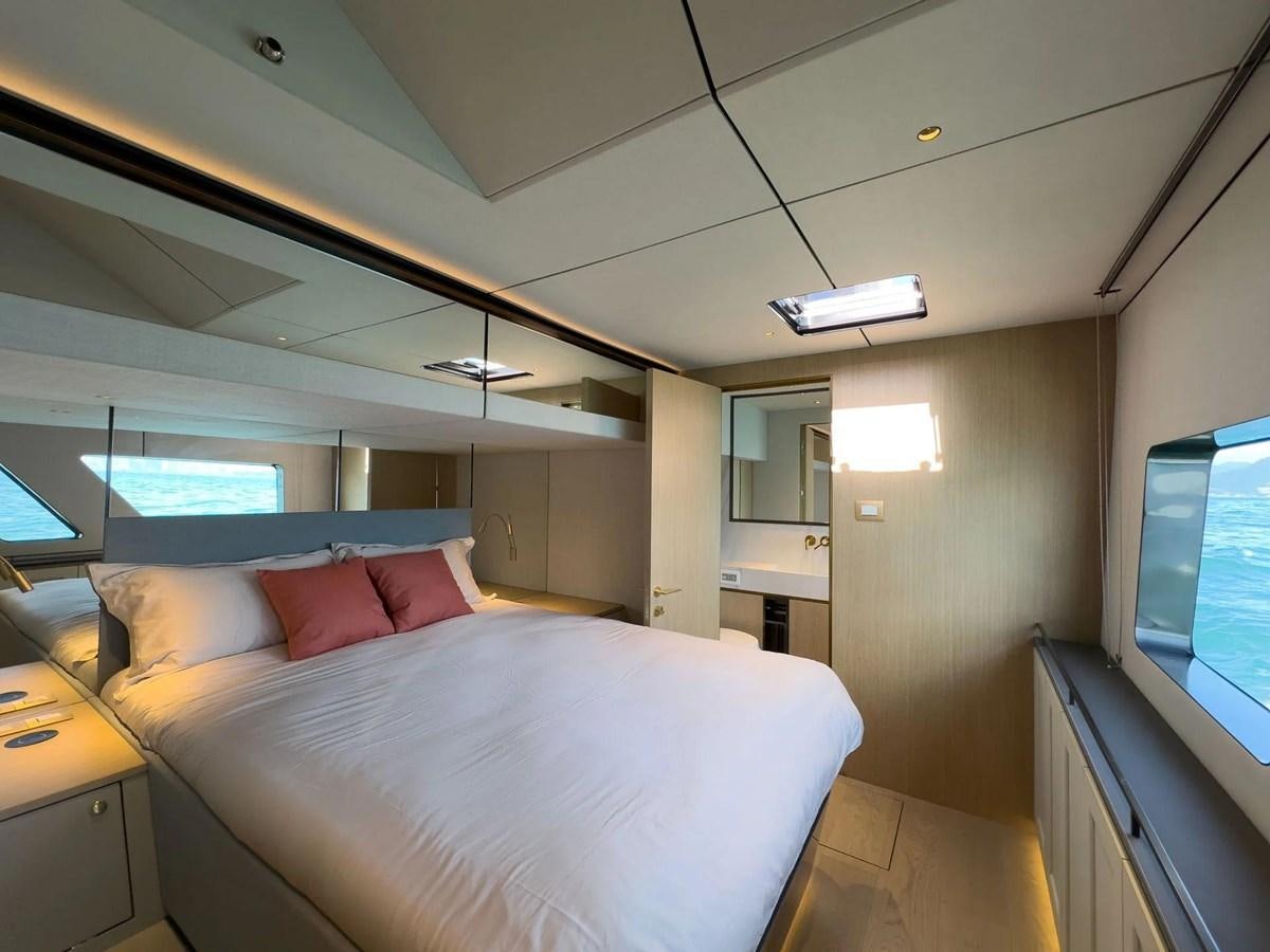 a bed in a room aboard BUNDALONG Yacht for Sale