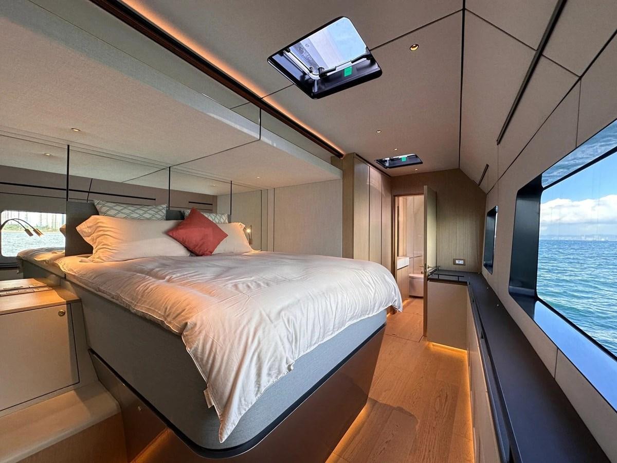 a bed in a room aboard BUNDALONG Yacht for Sale