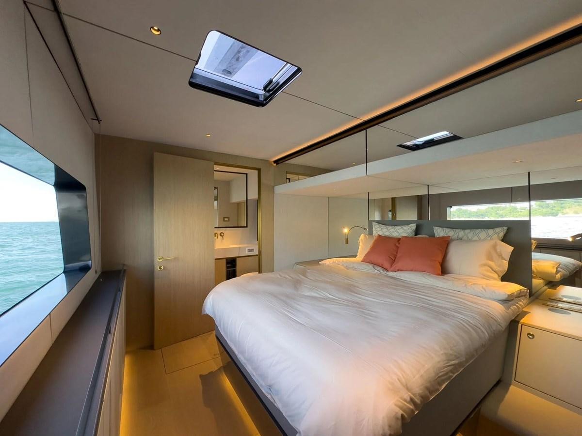 a bed in a room aboard BUNDALONG Yacht for Sale