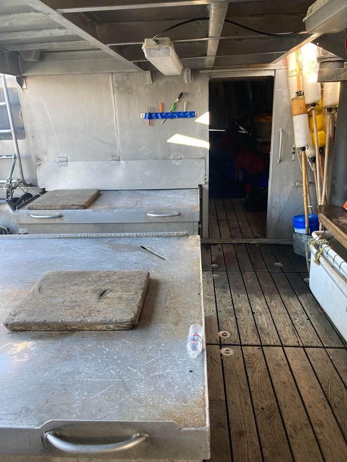 a room with a wood floor and a wood floor aboard 1979 CUSTOM LONGLINE/TENDER/CRABBER Yacht for Sale