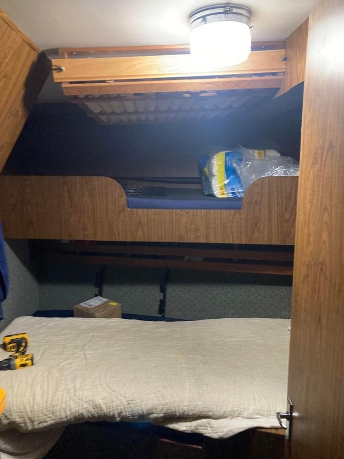 a shelf with a bed aboard 1979 CUSTOM LONGLINE/TENDER/CRABBER Yacht for Sale