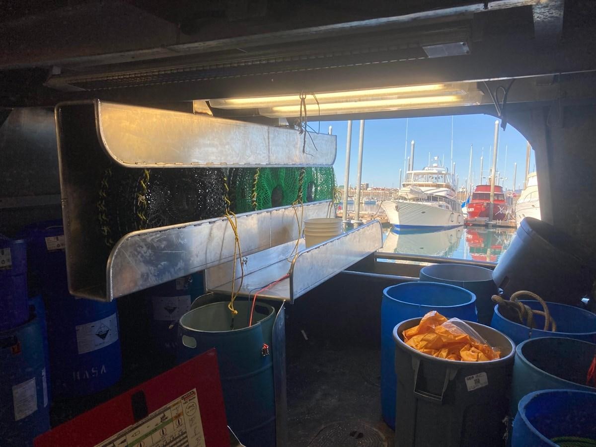 a container of food and a bucket aboard 1979 CUSTOM LONGLINE/TENDER/CRABBER Yacht for Sale